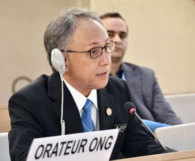 写真：国連人権理事会で演説する沖縄県の玉城デニー知事＝１８日、スイス・ジュネーブ（共同）