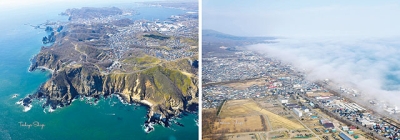 写真：上空から撮影した海霧に覆われる登別市街地（右）と地球岬（志賀俊哉さん提供）