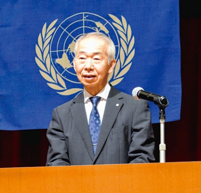 写真：定時総会であいさつする酒匂新会長