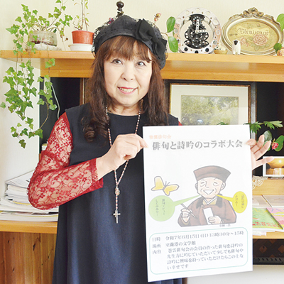 写真：来場を呼びかける藤原代表