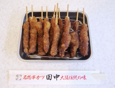 写真：串カツ田中の「無限ニンニクホルモン串」
