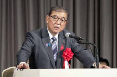 写真：連合の定期大会であいさつする石破首相＝７日午前、東京都新宿区