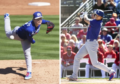 写真：米大リーグ、ドジャースのオープン戦初戦のエンゼルス戦に先発した山本由伸（左）。大谷翔平は１回に三塁内野安打を放った＝２１日、アリゾナ州テンピ（共同）